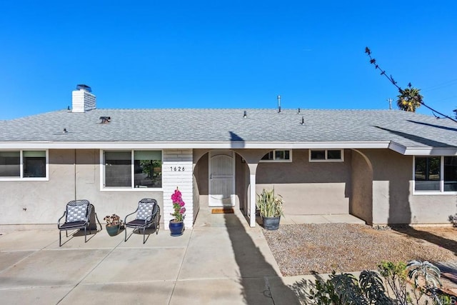 ranch-style house featuring a patio area