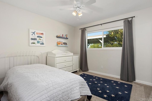 bedroom with ceiling fan and light colored carpet