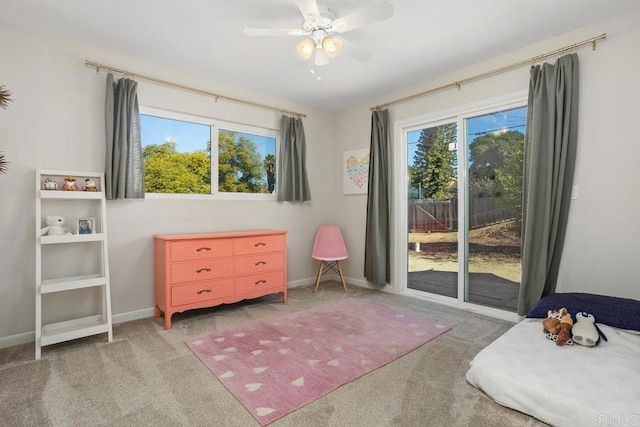 carpeted bedroom with ceiling fan and access to outside