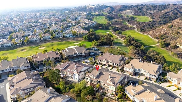 drone / aerial view featuring a residential view and view of golf course