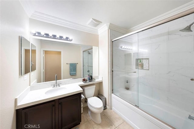 bathroom featuring vanity, bath / shower combo with glass door, crown molding, toilet, and tile patterned floors