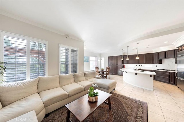 living room featuring light tile patterned floors and ornamental molding