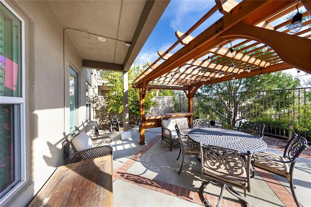 view of patio / terrace featuring outdoor dining space, a fenced backyard, and a pergola