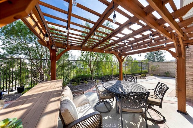 view of patio with outdoor dining area, a fenced backyard, and a pergola