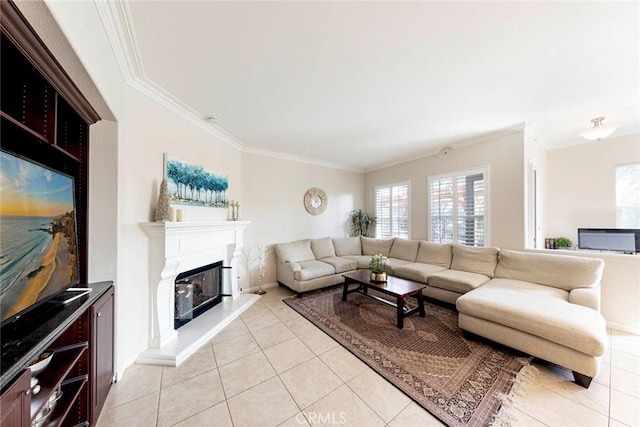 living room with light tile patterned floors, baseboards, a glass covered fireplace, and crown molding