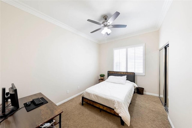 bedroom featuring baseboards, crown molding, and carpet floors