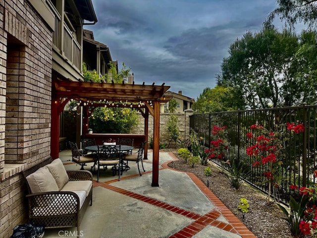 view of patio with a pergola, outdoor dining area, and a fenced backyard