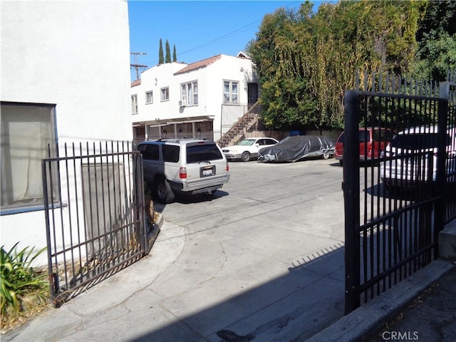 152 S Westmoreland Ave, Los Angeles, CA 90004 - view of concrete driveway with a gate and a gated entry