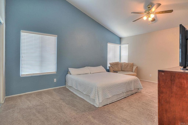 bedroom featuring ceiling fan, light carpet, and lofted ceiling