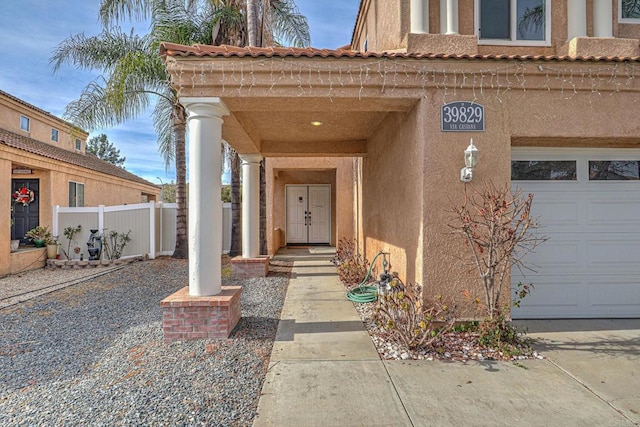 view of exterior entry featuring a garage