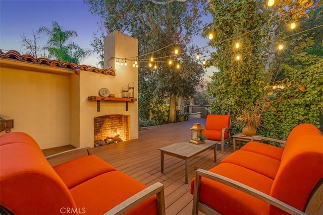 exterior space featuring an outdoor living space with a fireplace