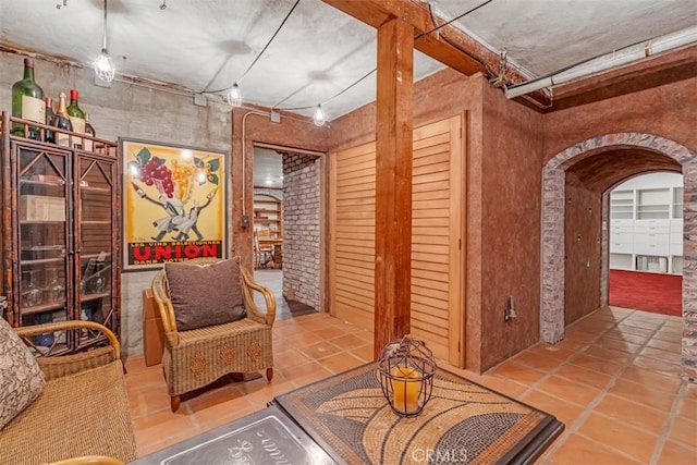 living area with tile patterned floors