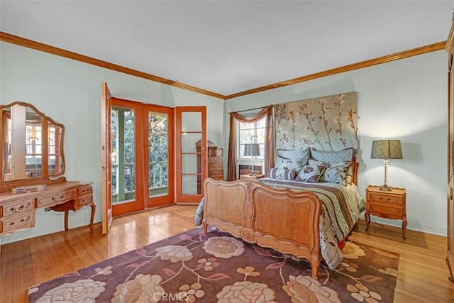 bedroom with multiple windows, french doors, ornamental molding, and light hardwood / wood-style flooring