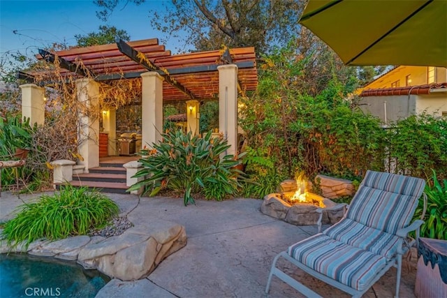 view of patio featuring a fire pit