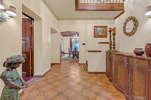 hall featuring light tile patterned floors