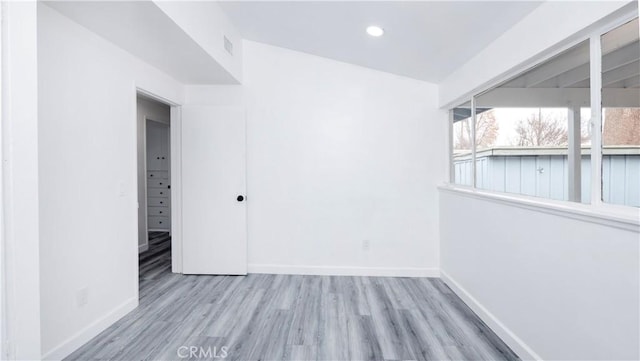 unfurnished room with light hardwood / wood-style floors