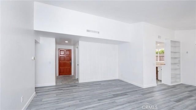 unfurnished room featuring light hardwood / wood-style flooring