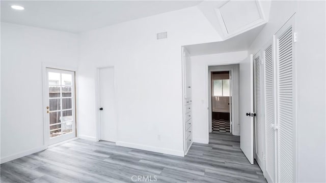 spare room featuring hardwood / wood-style flooring