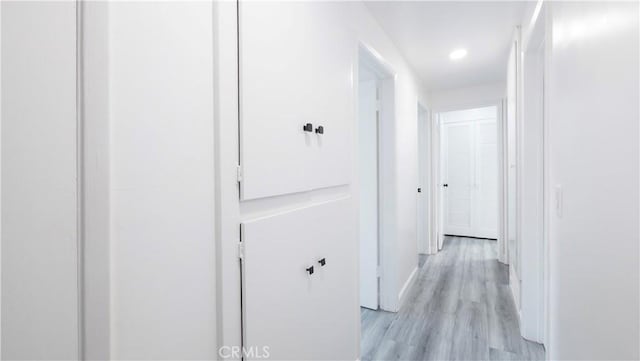 hall with light hardwood / wood-style floors