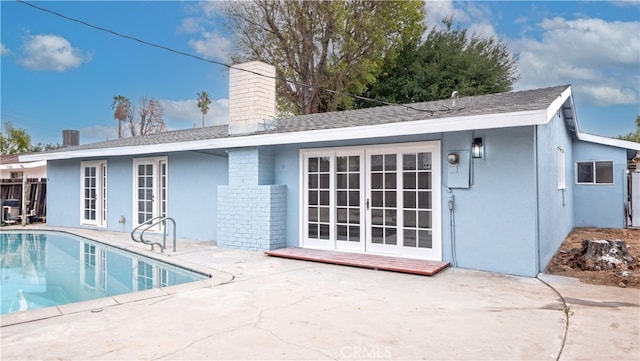 back of house with french doors and a patio