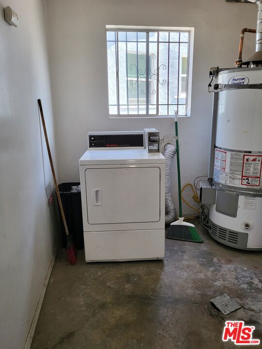 laundry area featuring washer / dryer and gas water heater