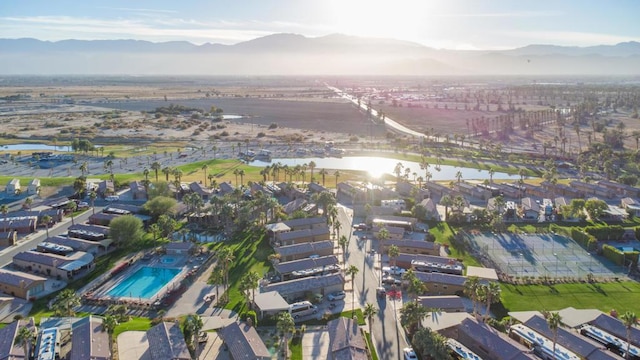 drone / aerial view featuring a water and mountain view