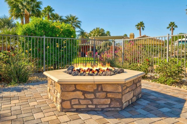 view of patio with an outdoor fire pit