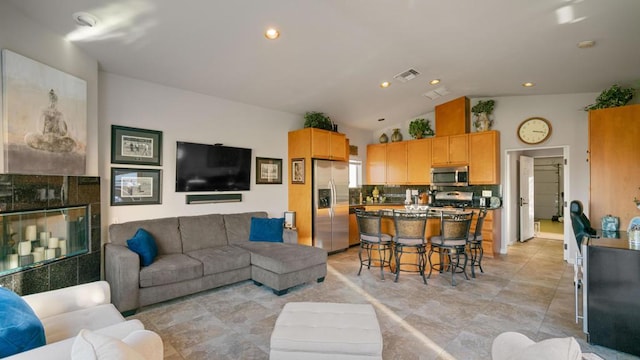 living room with vaulted ceiling