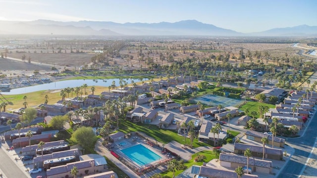 drone / aerial view with a water and mountain view