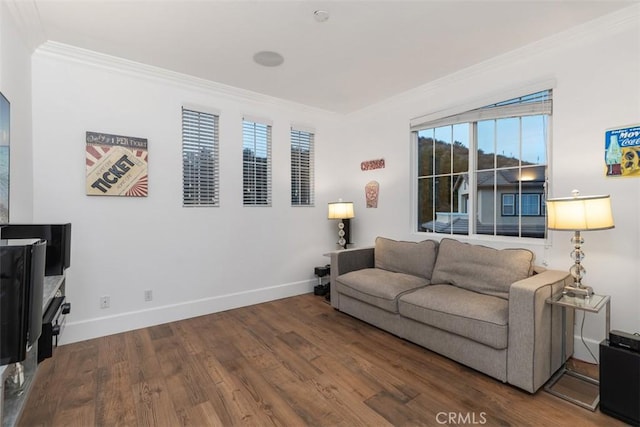 living room with crown molding and hardwood / wood-style flooring