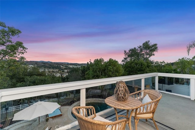 view of balcony at dusk