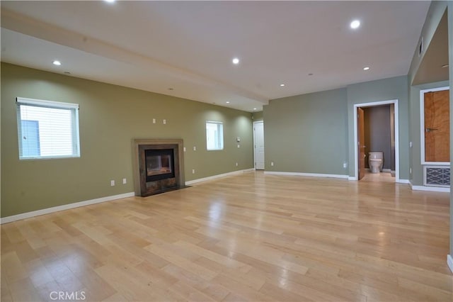 unfurnished living room with light wood-type flooring