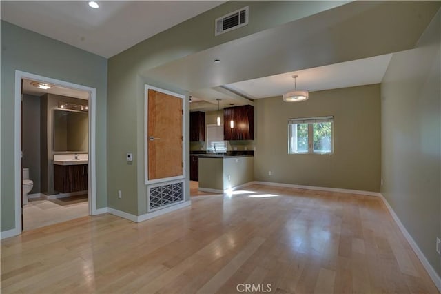 unfurnished living room featuring light hardwood / wood-style floors