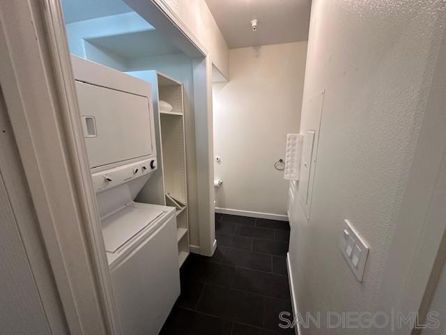 laundry room featuring stacked washer / dryer