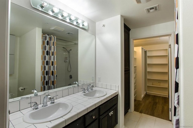 bathroom with vanity and tile patterned flooring