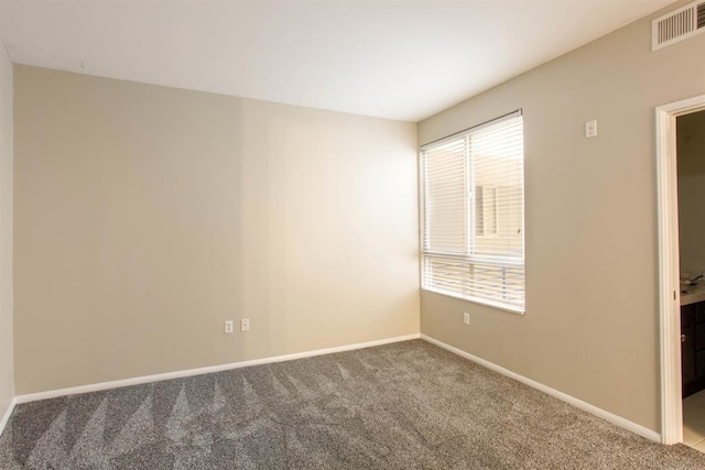 unfurnished room featuring carpet floors