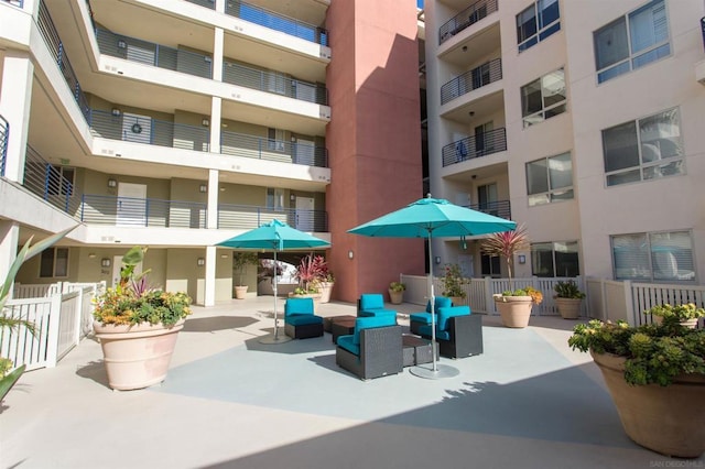 view of home's community featuring outdoor lounge area and a patio