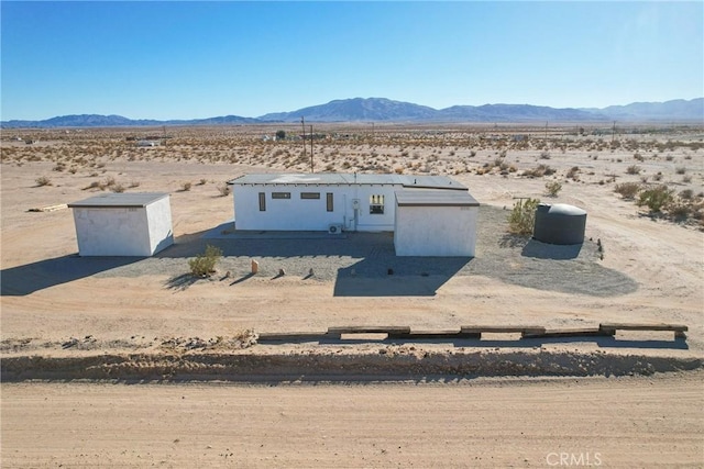 entry to storm shelter with a mountain view