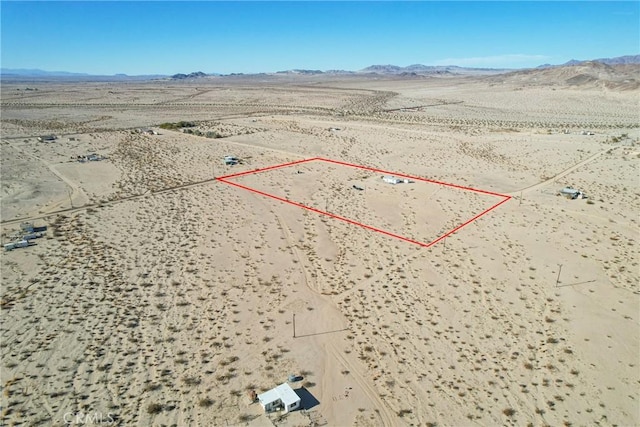 birds eye view of property featuring a mountain view