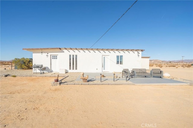 rear view of property with a patio