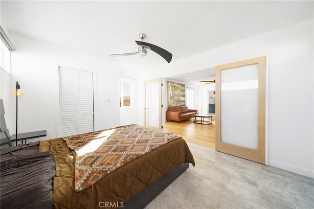 bedroom featuring ceiling fan and a closet