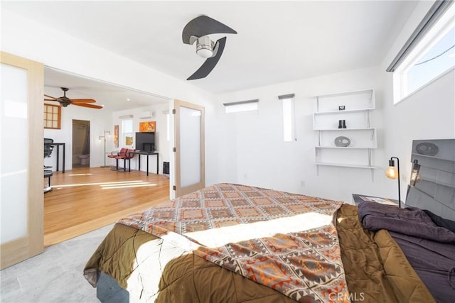 bedroom featuring light wood-type flooring and ceiling fan