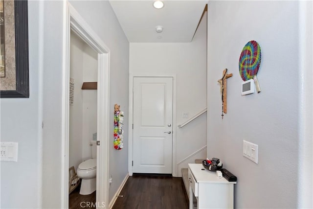 hallway with dark wood-type flooring