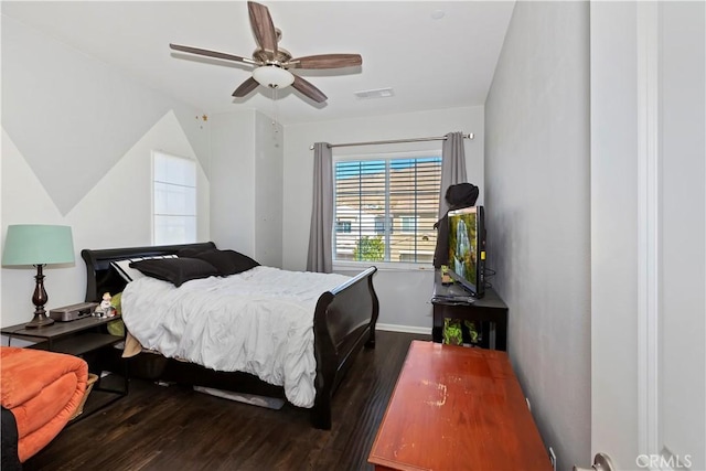 bedroom featuring vaulted ceiling, ceiling fan, and dark hardwood / wood-style flooring