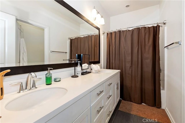 bathroom featuring shower / bath combination with curtain and vanity