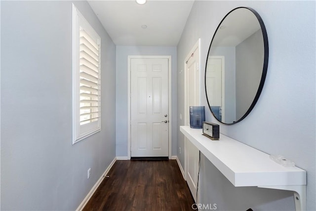 entryway with dark hardwood / wood-style flooring