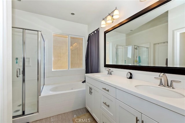 bathroom featuring separate shower and tub, hardwood / wood-style flooring, and vanity