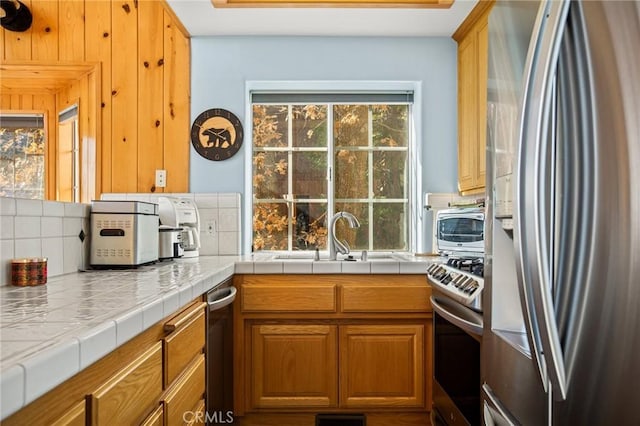 2477 Spring Oak Dr, Running Springs, CA 92382 - kitchen with appliances with stainless steel finishes, brown cabinetry, and a sink