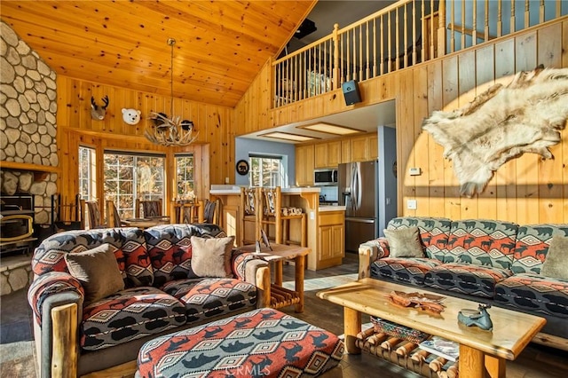 2477 Spring Oak Dr, Running Springs, CA 92382 - living room with high vaulted ceiling, wood walls, wooden ceiling, and light wood-type flooring