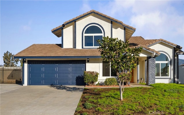 view of front of property with a front yard and a garage